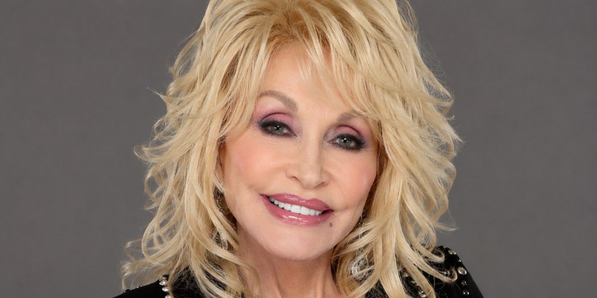 Dolly Parton age biography image featuring a close-up portrait with blonde hair and a soft grey background.